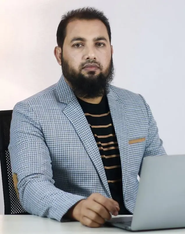 Nazir Hossain working on computer